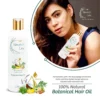 Woman holding Botanical Hair Oil 200ml – Natural hair care with Vitamin E